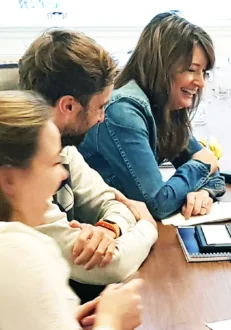 Course participants laughing during business English small group course in Amsterdam